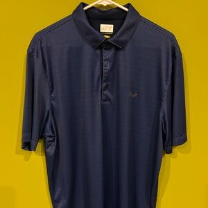 Greg Norman golf shirt navy blue.
